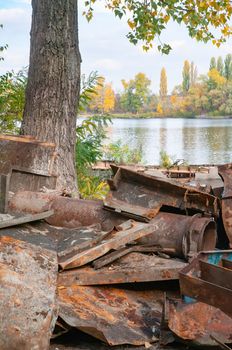 Rust metal pieces dump, probably an old broken boat, close to the Dnieper river in Kiev, Ukraine.