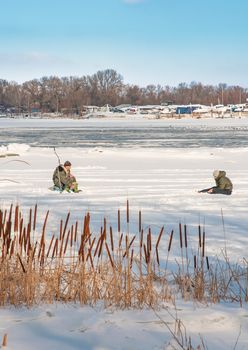 Kiev/Ukraine - February 21, 2012 - Fishermen on the frozen Dnieper in the Obolon district of Kiev, Ukraine, during a cold winter