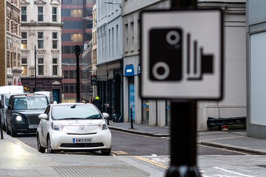 London, England, UK - December 31, 2019: A car with a speed camera on the roof records violations on city street