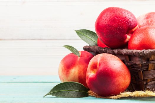 Sweet nectarine on wooden background