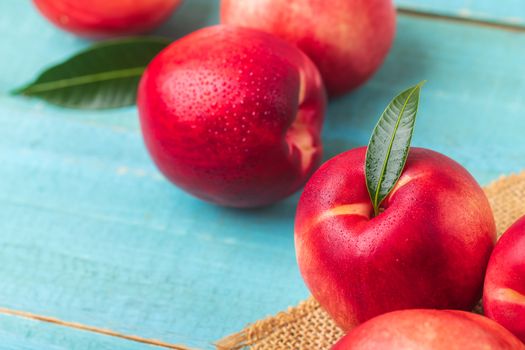 Sweet nectarine on wooden background