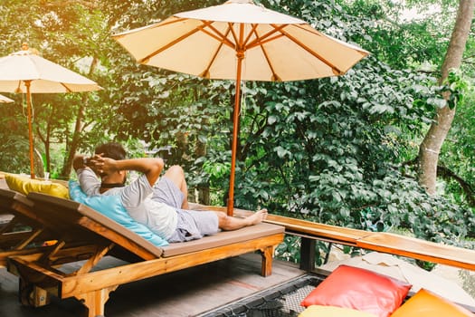 Relaxing moments, Asian relaxing outdoor on the lake in sunset. Relax time on holiday concept travel.