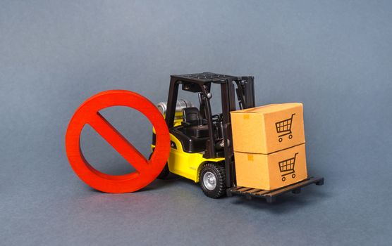 Yellow Forklift truck carries boxex and a red prohibition symbol NO. Embargo trade wars. Restriction on importation production, ban on export of dual-use goods to countries under sanctions