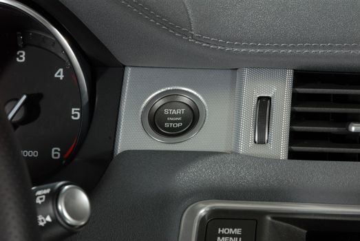 Start stop engine button on a modern car dashboard
