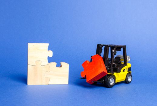 forklift truck brings the missing red puzzle to the unfinished set. construction and completion of the project. Assembly of all components. Attracting investment to the project. Startup, crowdfunding.