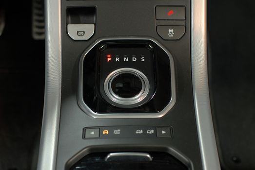 Aluminium gear stick with control panel in a luxury car