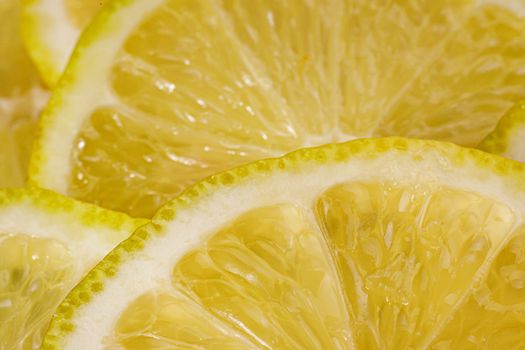 Lemon background. Close up view of lemon slices. Citrus texture