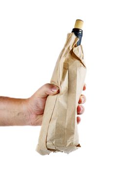 Hand hold wine bottle in brown paper bag isolated on white background