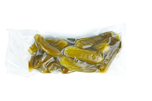 Marinated pickled cucumbers in plastic vacuum package isolated on white