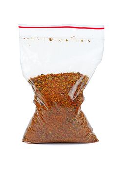 Plastic bag with mixed spices for barbecue isolated on white background