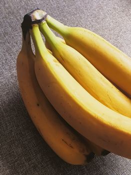 Organic bananas on rustic linen background, fruits farming and agriculture