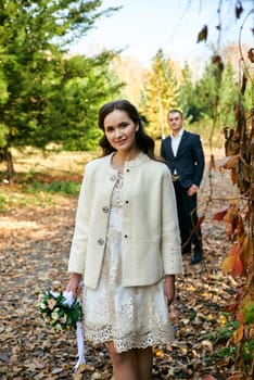 Couple in love close-up portrait. Young male and woman just married. Concept of happy family. Modern family outdoor. Adorable family demonstrate love and care. Autumn vacation.