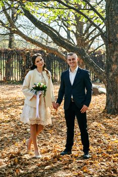 Couple in love close-up portrait. Young male and woman just married. Concept of happy family. Modern family outdoor. Adorable family demonstrate love and care. Autumn vacation.