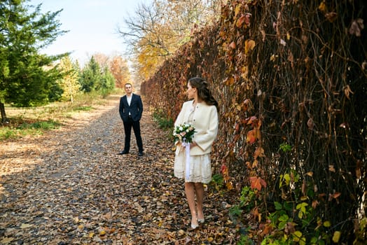 Couple in love close-up portrait. Young male and woman just married. Concept of happy family. Modern family outdoor. Adorable family demonstrate love and care. Autumn vacation.