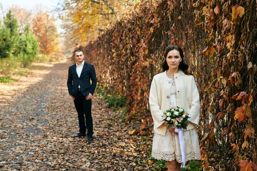 Couple in love close-up portrait. Young male and woman just married. Concept of happy family. Modern family outdoor. Adorable family demonstrate love and care. Autumn vacation.