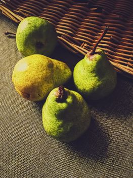 Organic pears on rustic linen background, fruits farming and agriculture