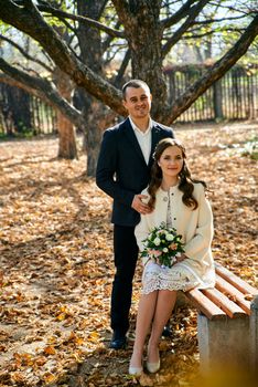 Couple in love close-up portrait. Young male and woman just married. Concept of happy family. Modern family outdoor. Adorable family demonstrate love and care. Autumn vacation.