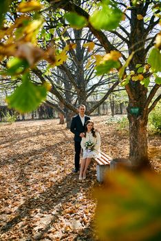 Couple in love close-up portrait. Young male and woman just married. Concept of happy family. Modern family outdoor. Adorable family demonstrate love and care. Autumn vacation.