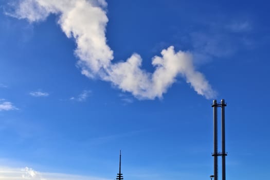 Industry pollution from factories in a blue sky