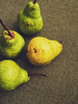 Organic pears on rustic linen background, fruits farming and agriculture