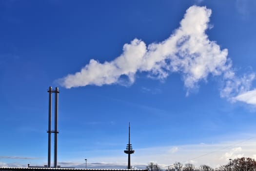 Industry pollution from factories in a blue sky