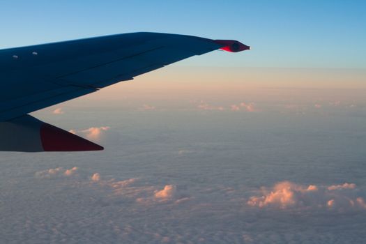 Clouds From a Plane Window at Dusk