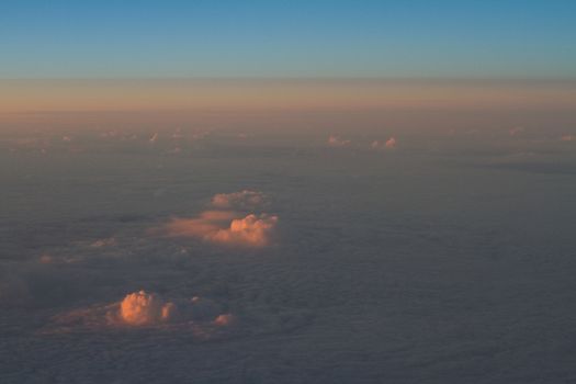 Clouds From a Plane Window at Dusk