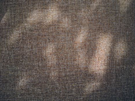 Linen texture and shadows as rustic background, fabric and material