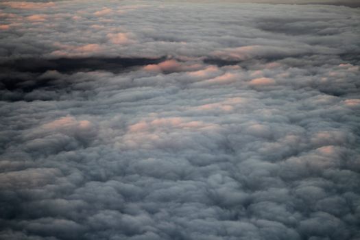 Clouds From a Plane Window at Dusk