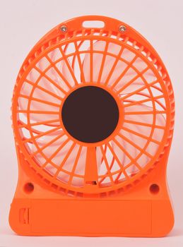 Orange mini fan, Portable fan USB on white background