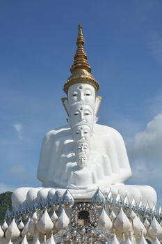 Five sitting Buddhas statue on blue sky, is a Buddhist monastery and temple in Phetchabun, Thailand. They are public domain or treasure of Buddhism, no restrict in copy or use
