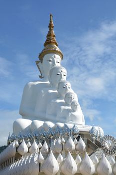 Five sitting Buddhas statue on blue sky, is a Buddhist monastery and temple in Phetchabun, Thailand. They are public domain or treasure of Buddhism, no restrict in copy or use