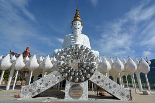 Five sitting Buddhas statue on blue sky, is a Buddhist monastery and temple in Phetchabun, Thailand. They are public domain or treasure of Buddhism, no restrict in copy or use

