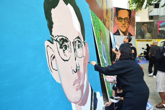 BANGKOK, THAILAND - November 12,2016 : Thai art students paint portraits of Thai King Bhumibol Adulyadej at Silpakorn University in Bangkok. King Bhumibol, the world's longest reigning monarch.