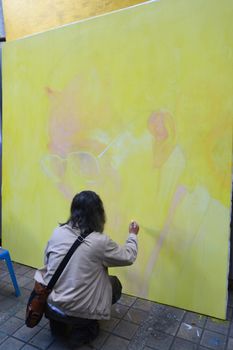 BANGKOK, THAILAND - November 12,2016 : Thai art students paint portraits of Thai King Bhumibol Adulyadej at Silpakorn University in Bangkok. King Bhumibol, the world's longest reigning monarch.