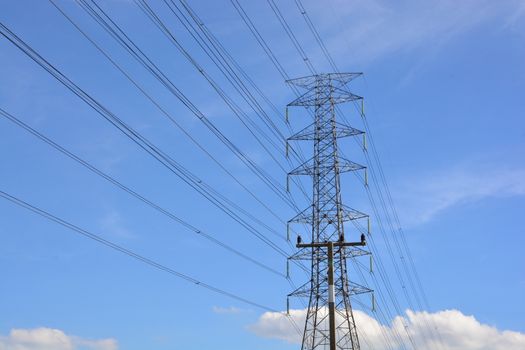 electricity transmission pylon against blue sky