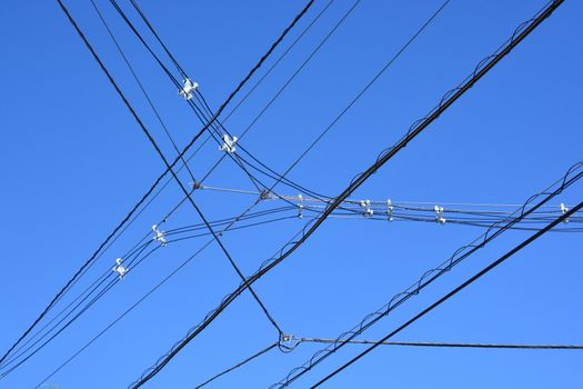 electricity transmission pylon against blue sky