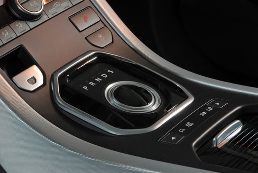Aluminium gear stick with control panel in a luxury car