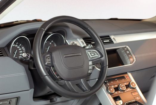 studio shot modern car interior with steering wheel