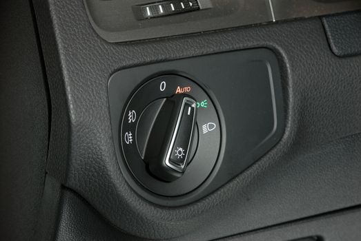 Close up image of car lighting control switch
