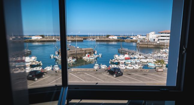 Port Joinville on the island of Yeu - September 17, 2018: view of the small port where maneuver fishing boats, tourism boats and sea shuttles going to the mainland on a summer day