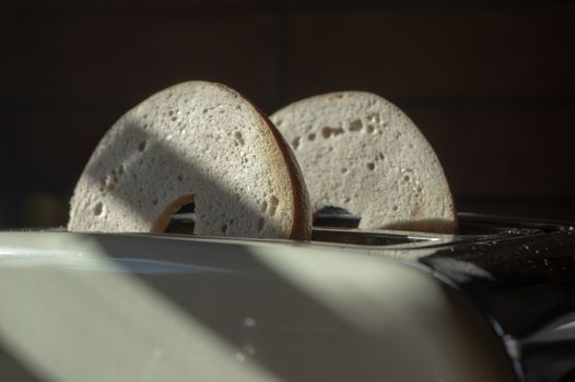 two bagel halfs in a toaster