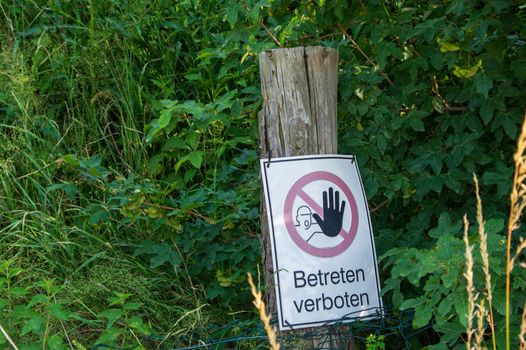Betreten Verboten (German for "no trespassing") sign near a sandpit