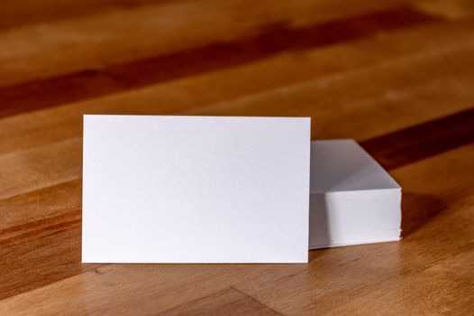 blank business cards on wooden surface