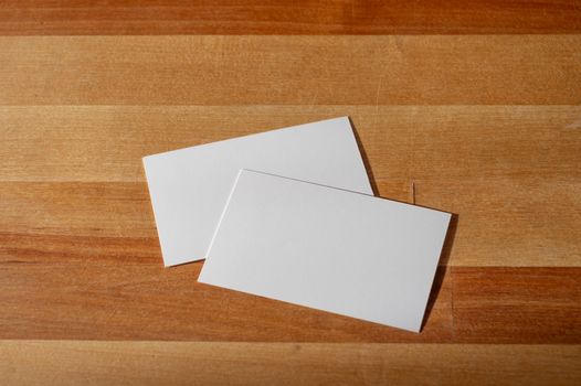 blank business card templates on wooden surface