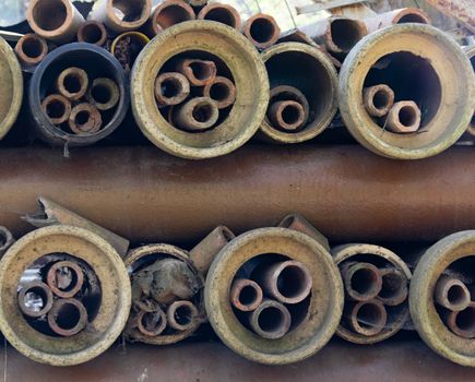old worn drainage clay tubing stacked