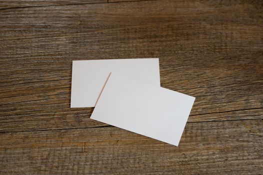 blank business card templates on wooden surface