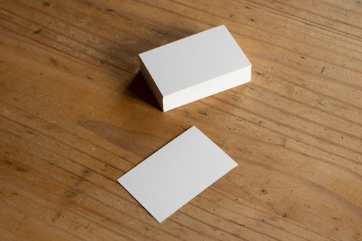 blank business cards on wooden surface