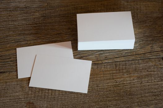 blank business card templates on wooden surface
