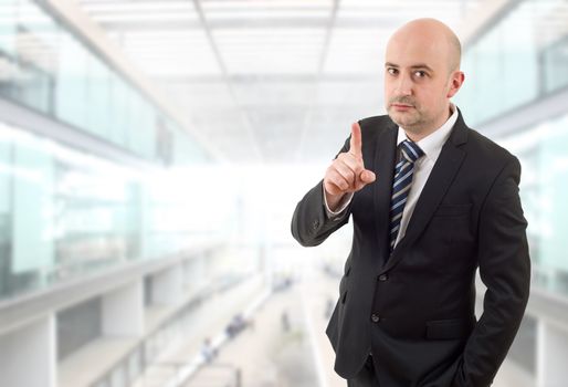 mad business man pointing, at the office